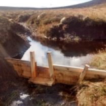 Gully blocking with wooden dams. Note the notch (used to direct water way from the sides and prevent erosion), and the plunge platform (again to prevent the dam being destabilised by the plunging water). ©Lochrosque Estate